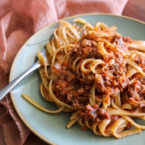 A plate of fettuccine with a hearty Italian meat sauce