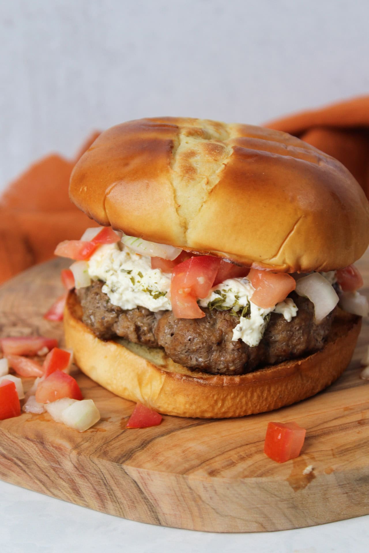 A bruschetta burger with garlic herb cheese.