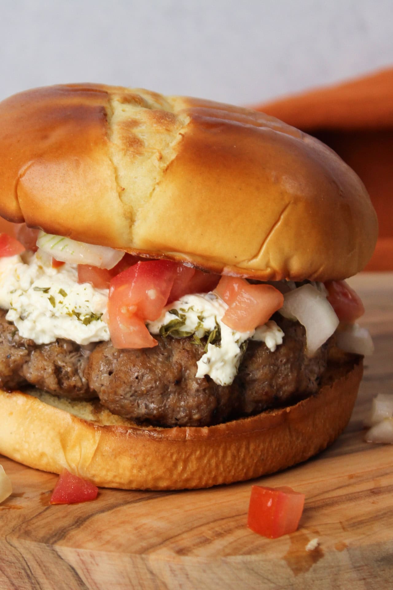 A bruschetta burger on brioche.