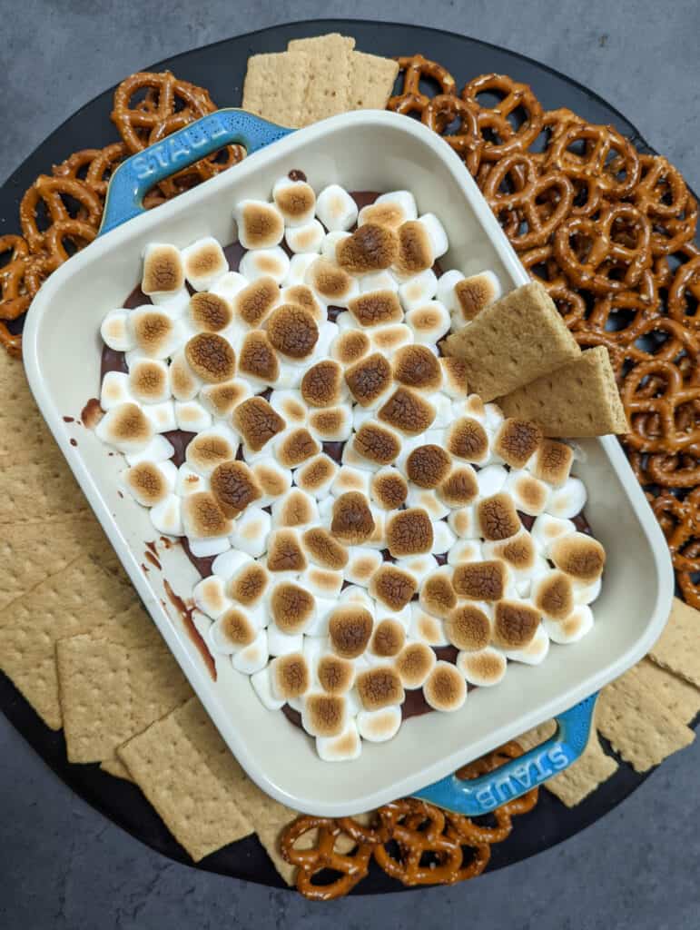 S'mores dip with graham crackers and pretzels for dipping
