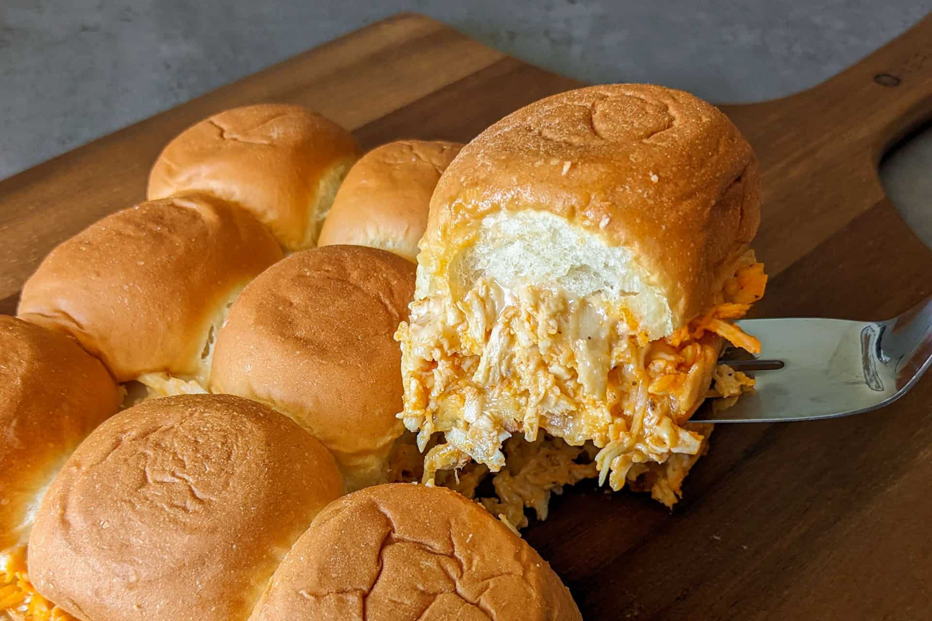 Cheesy buffalo chicken sliders on Hawaiian rolls