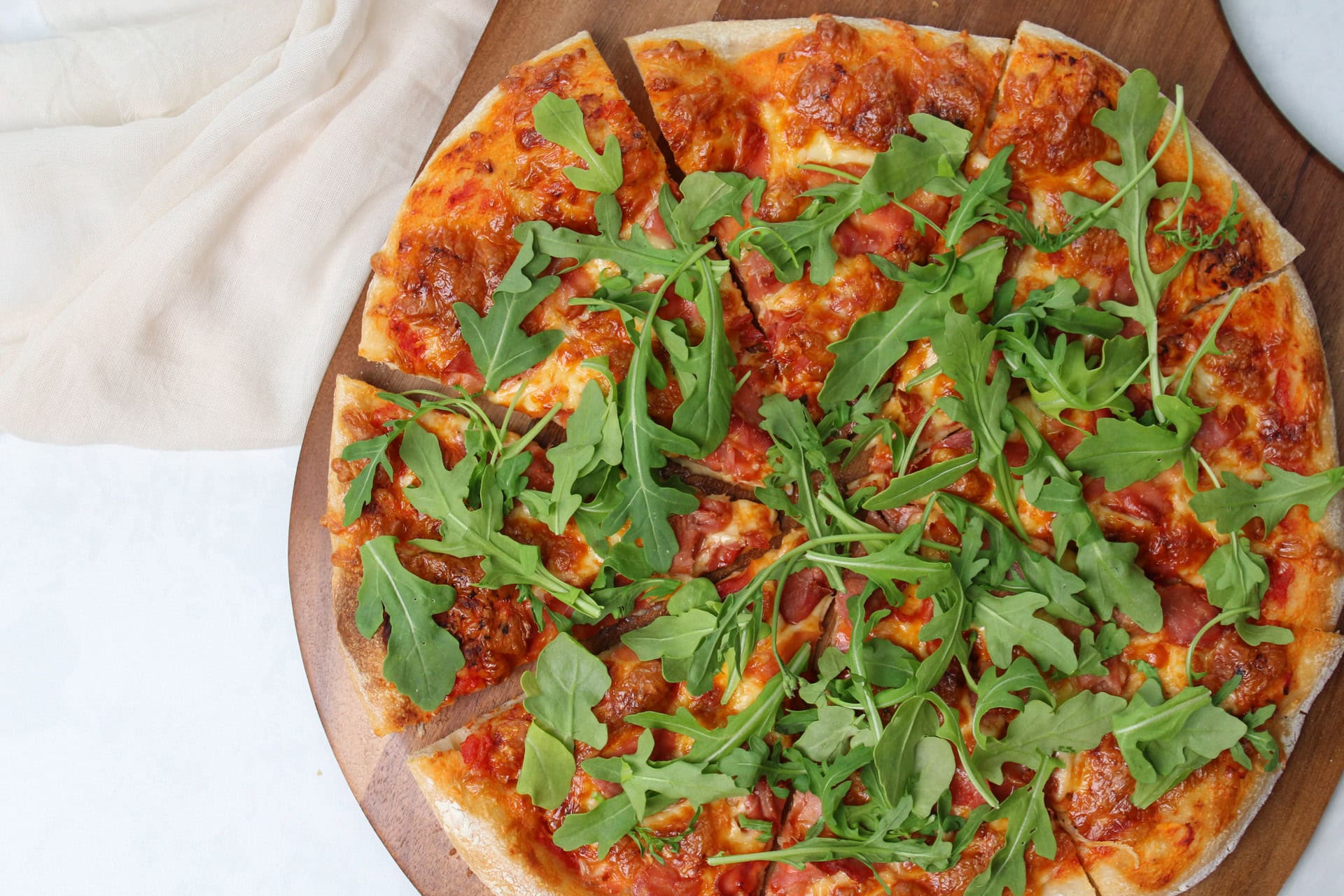 Prosciutto and arugula pizza.