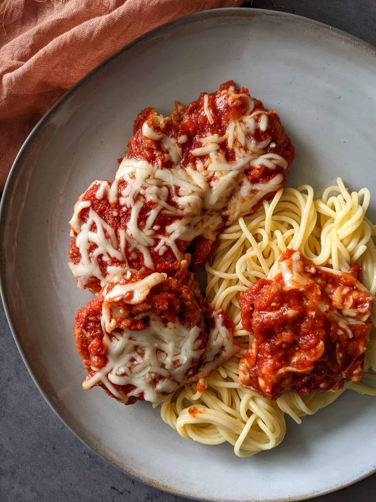 Eggplant parm with spaghetti on a plate