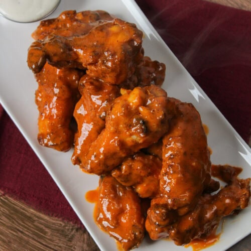 Buffalo wings on a plate.