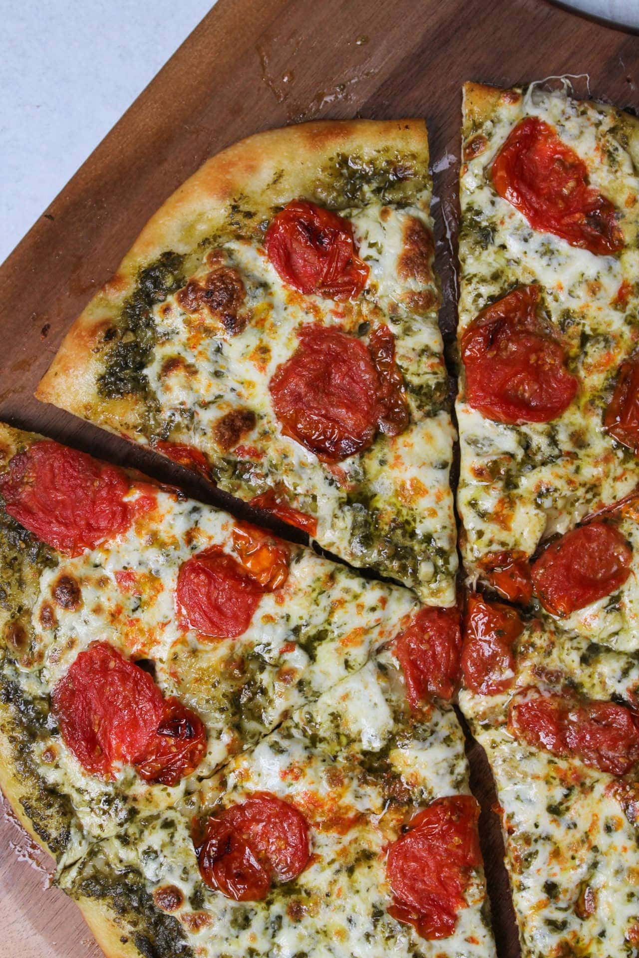 Roasted tomato mozzarella and pesto pizza.