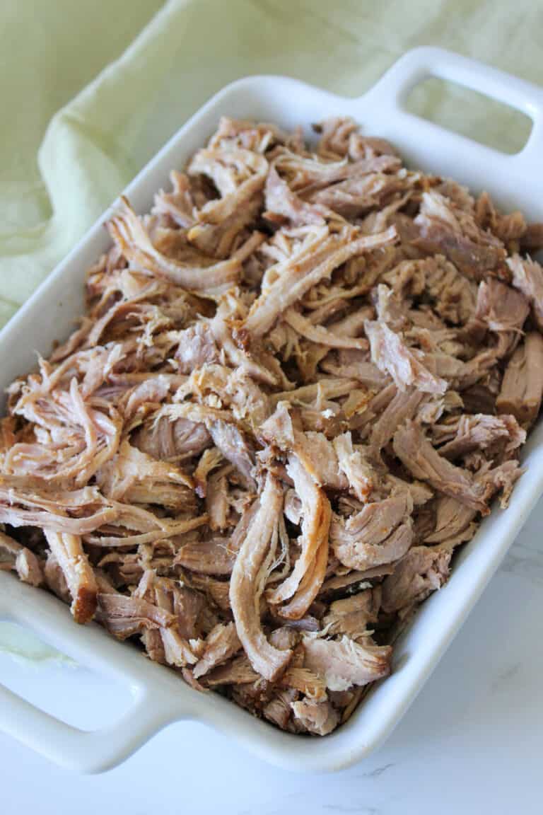 A serving dish of homemade crockpot carnitas