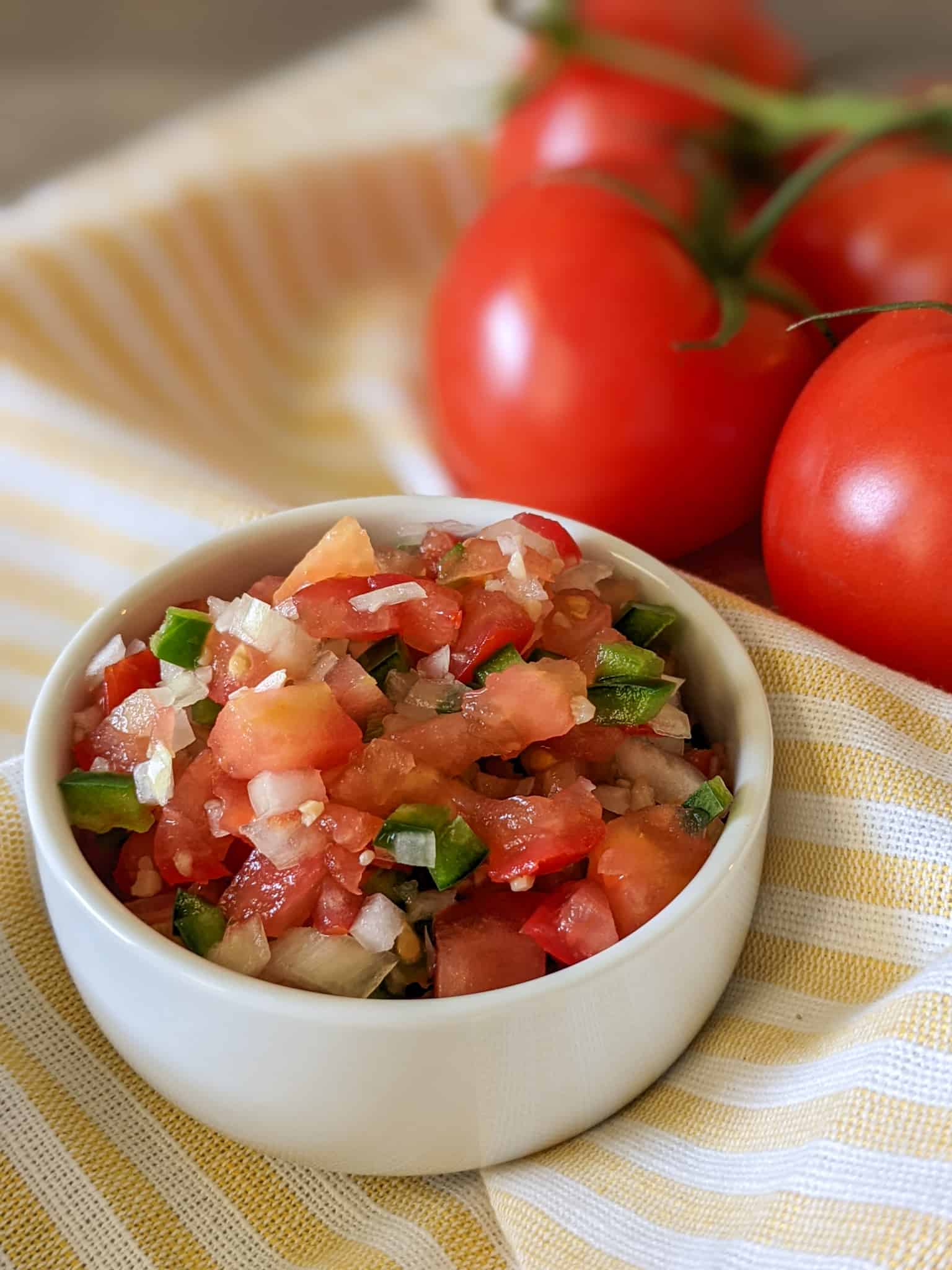 A bowl of pico de gallo made with fresh tomatoes