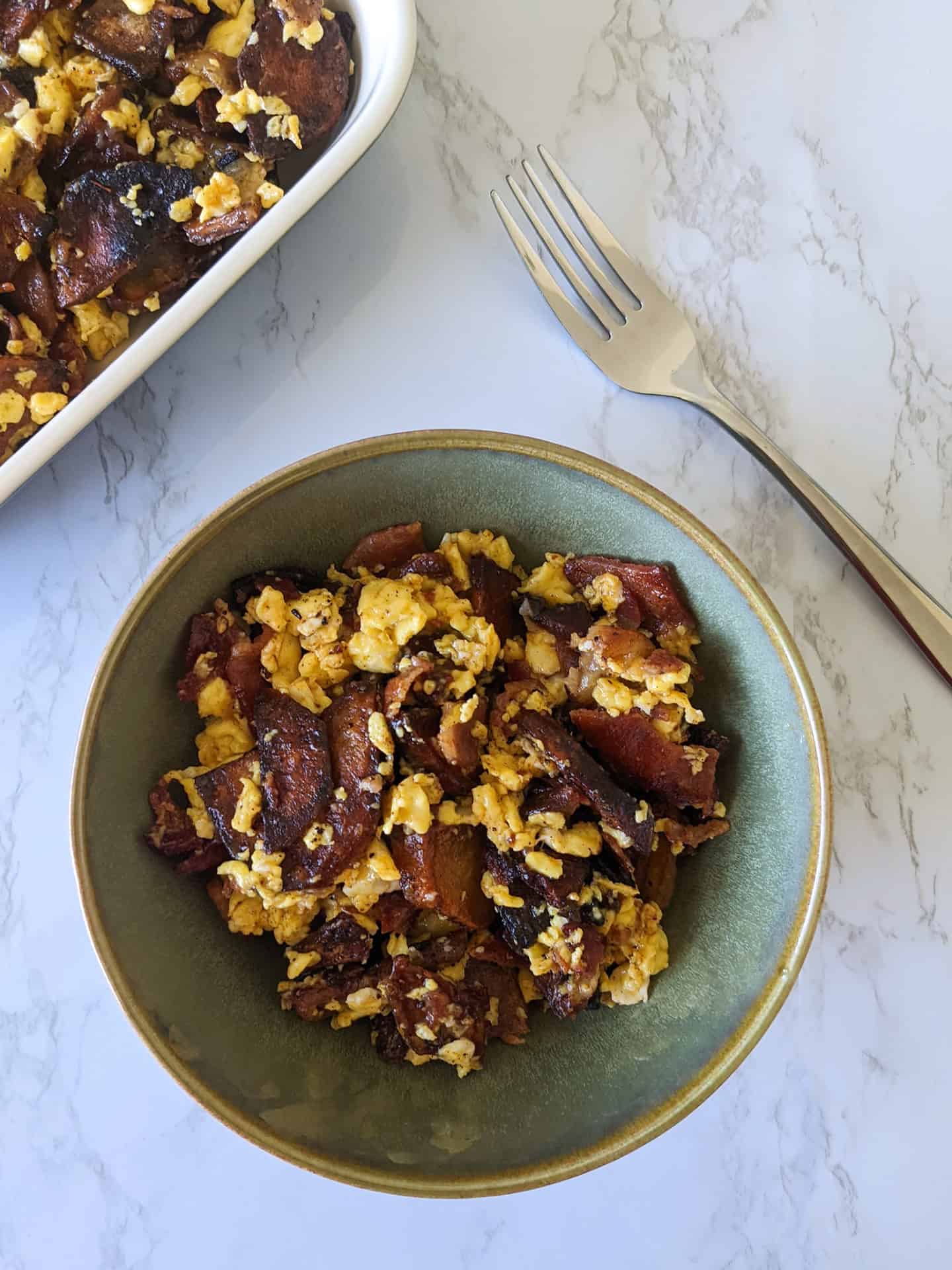 A breakfast scramble of bacon, eggs, and potatoes