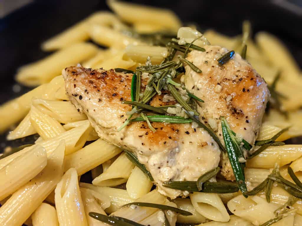 A dish of rosemary white wine chicken and pasta