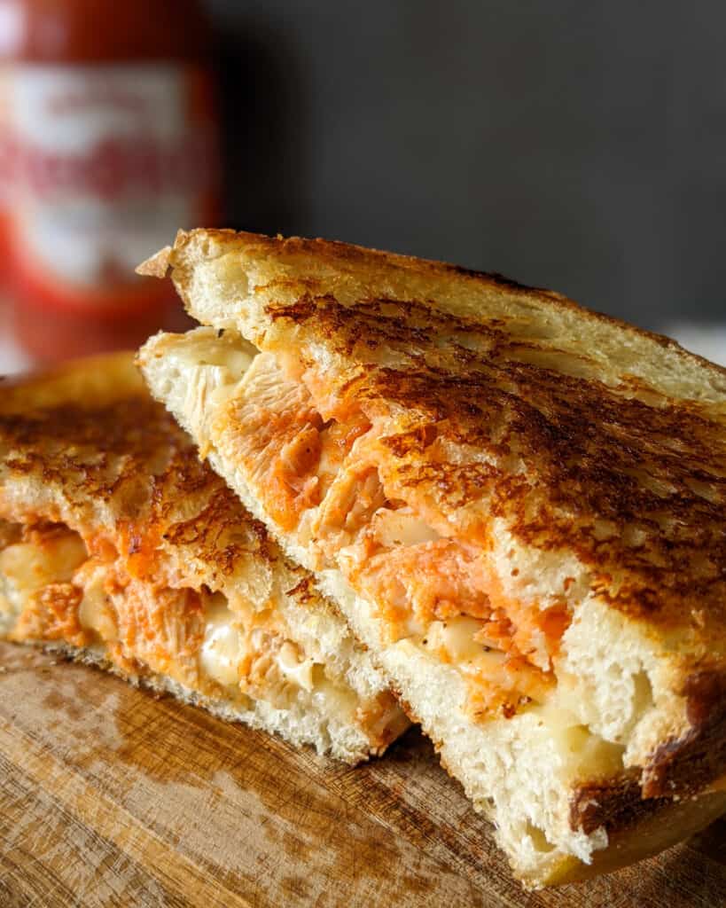 A buffalo chicken grilled cheese on sourdough made with Frank's Red Hot