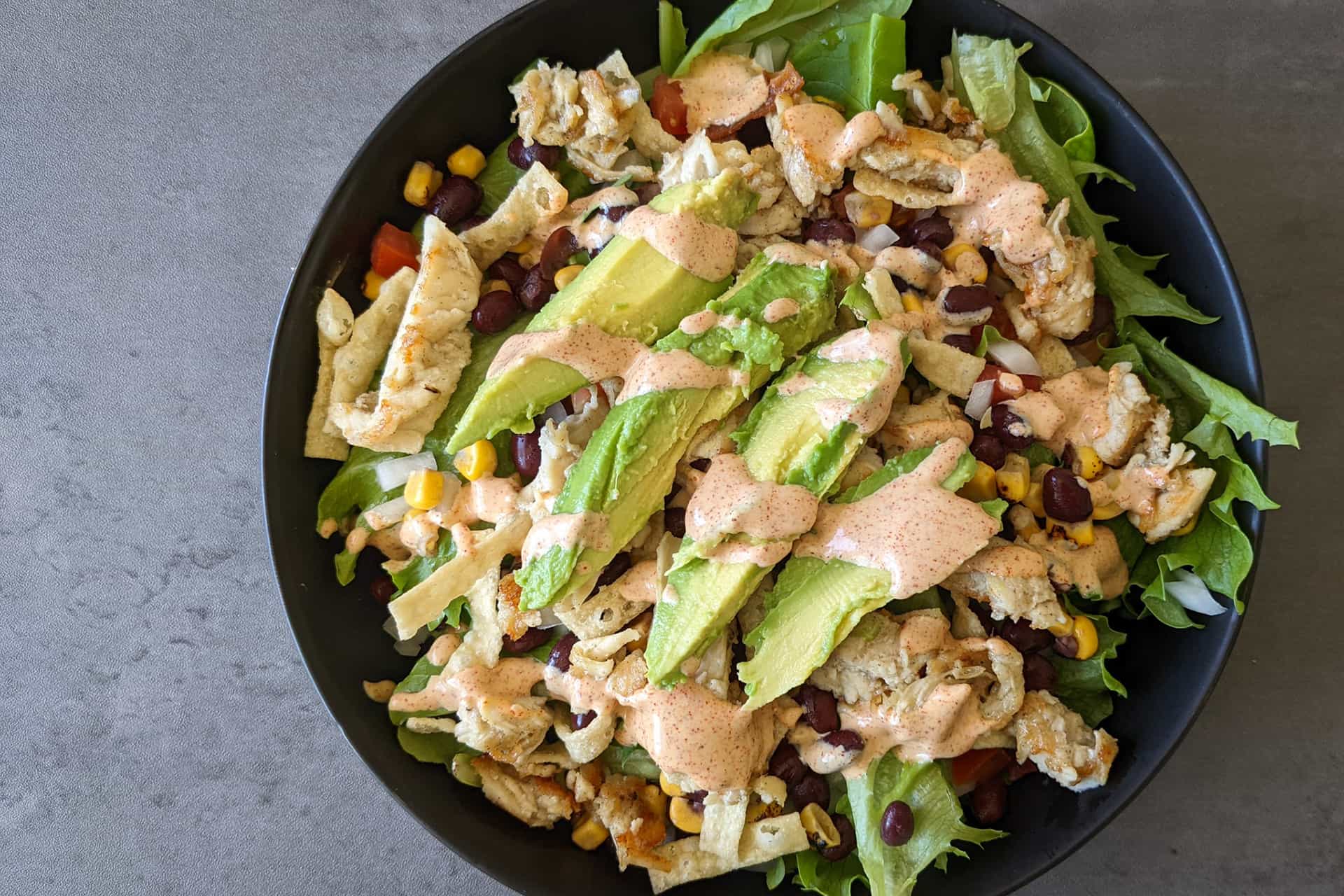A southwest salad with chili lime dressing and chicken