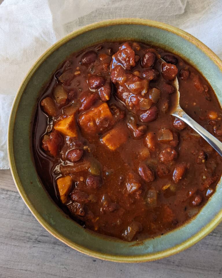A chunky chili made with sweet potatoes and black beans in a bowl
