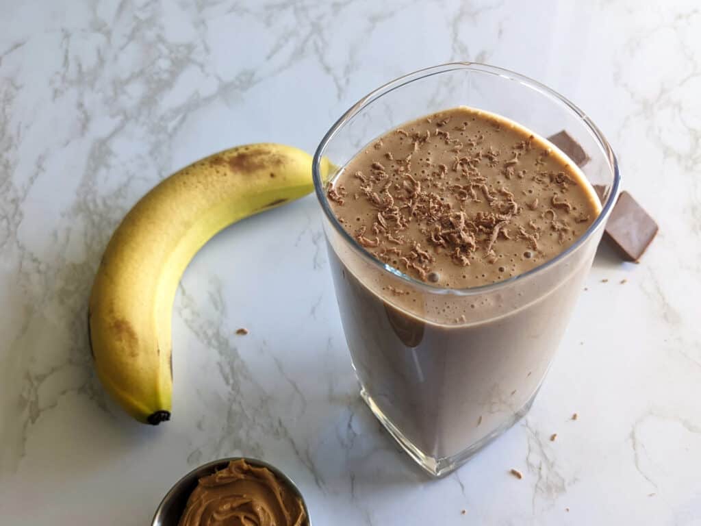 A protein shake made with peanut butter, banana, and chocolate protein powder