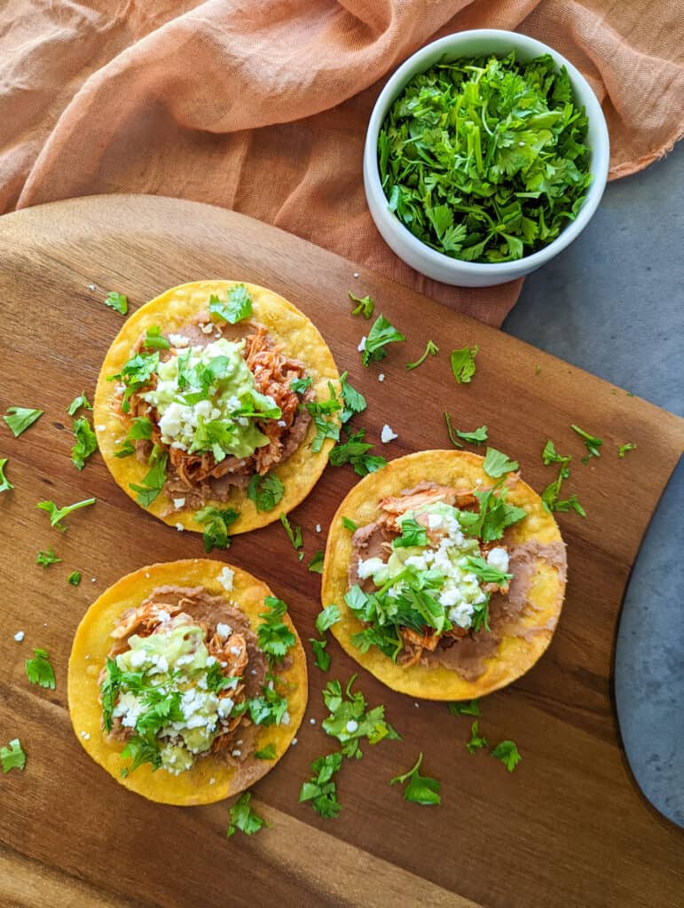 Authentic Mexican chicken tinga tostadas on a plate