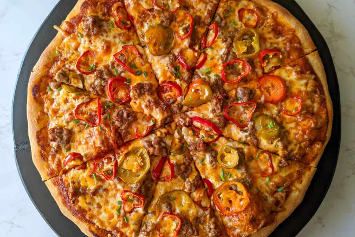 Spicy sausage and pepper pizza with Italian sausage and cherry peppers