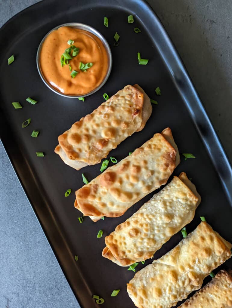 Crispy air fryer cheeseburger egg rolls with spicy mayo dip