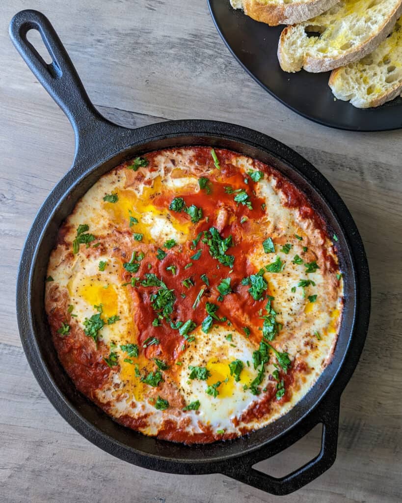 A cast iron skillet of shakshuka for two