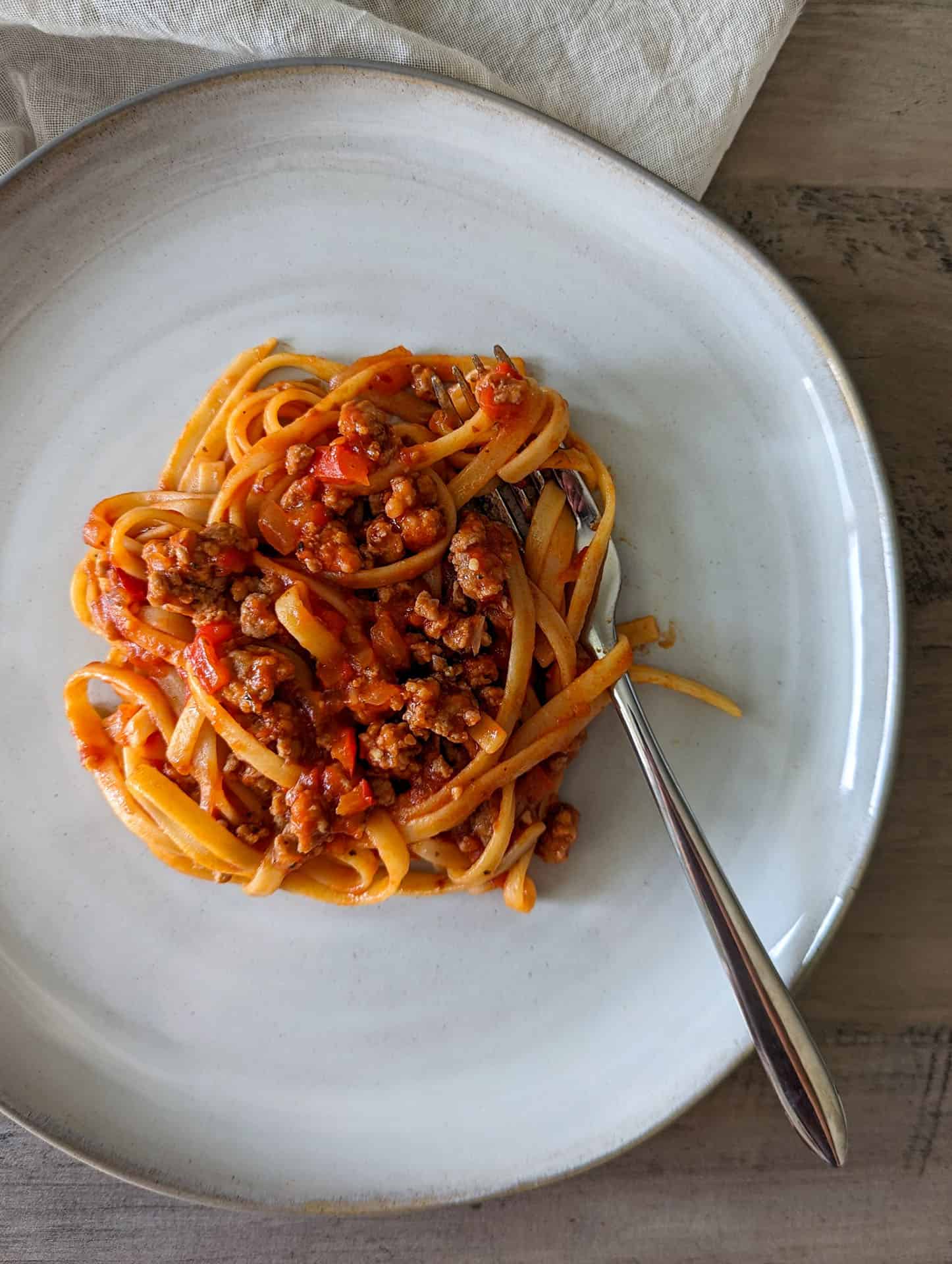 Italian style sausage and peppers pasta on a plate