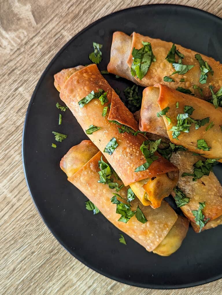 Avocado chorizo spring rolls served on a plate as game day appetizers