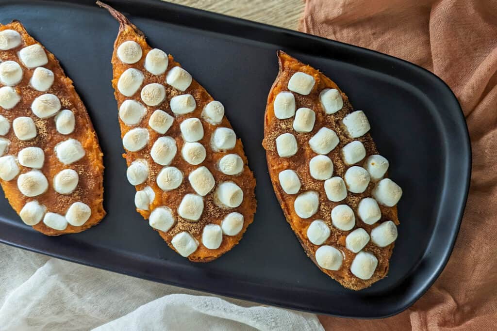 Mini sweet potato casserole boats for Thanksgiving made with mini marshmallows