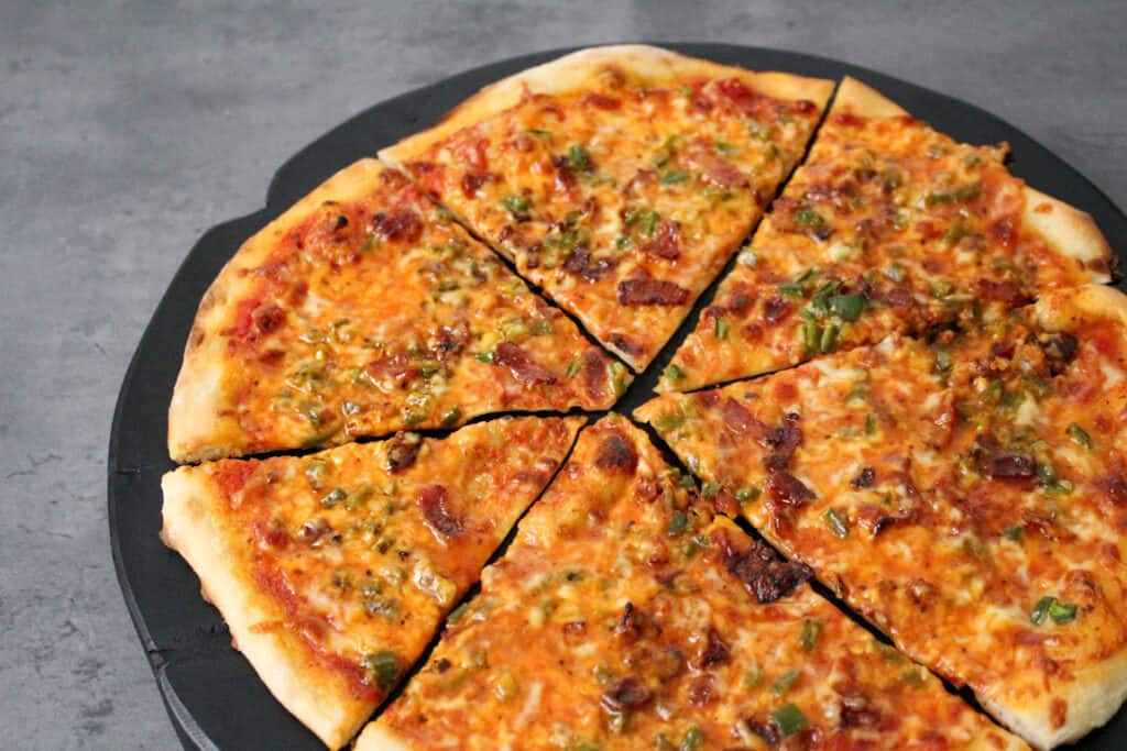 A thin crust pizza with a 3-cheese blend, bacon bits, jalapenos, and maple syrup