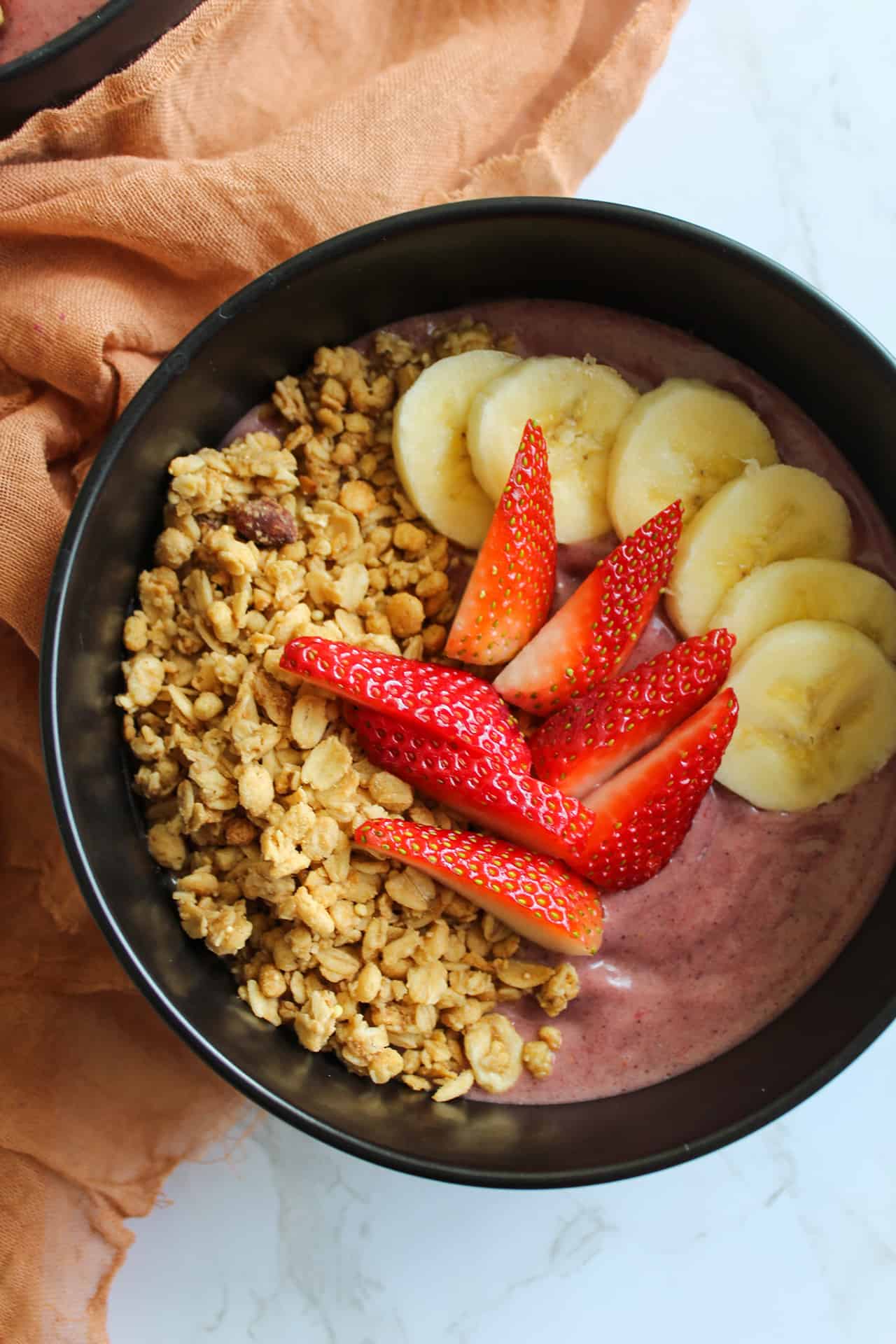 Dairy free acai bowls with granola, strawberries, and banana