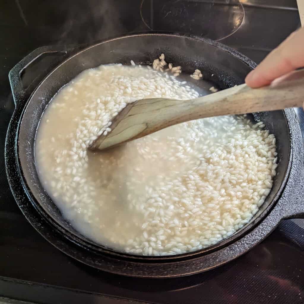 Risotto cooking in chicken broth