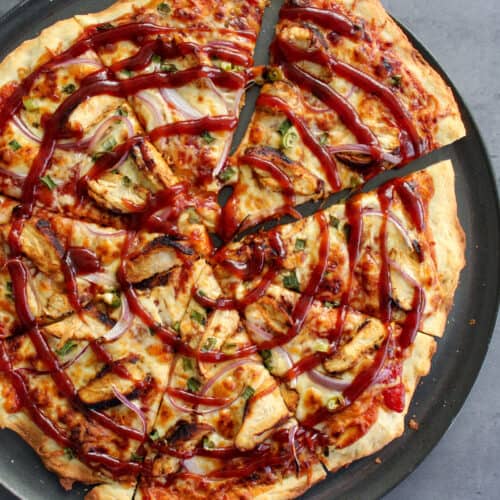 A homemade barbecue chicken pizza on thin crust