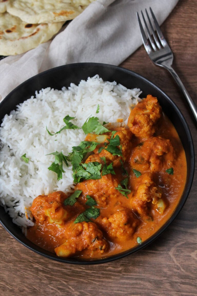 Cauliflower tikka masala with rice and naan.