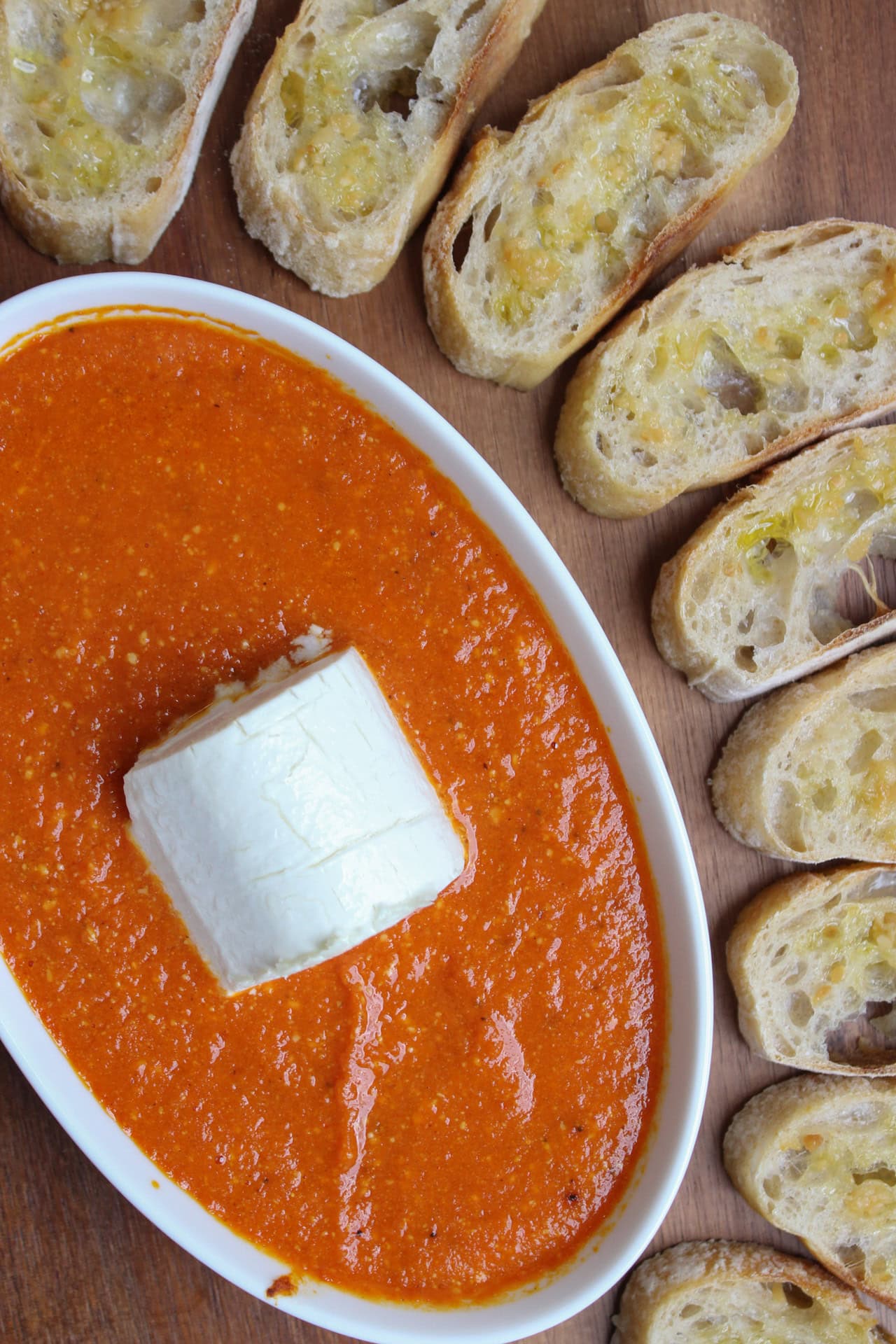 A goat cheese tomato dip with crostini.