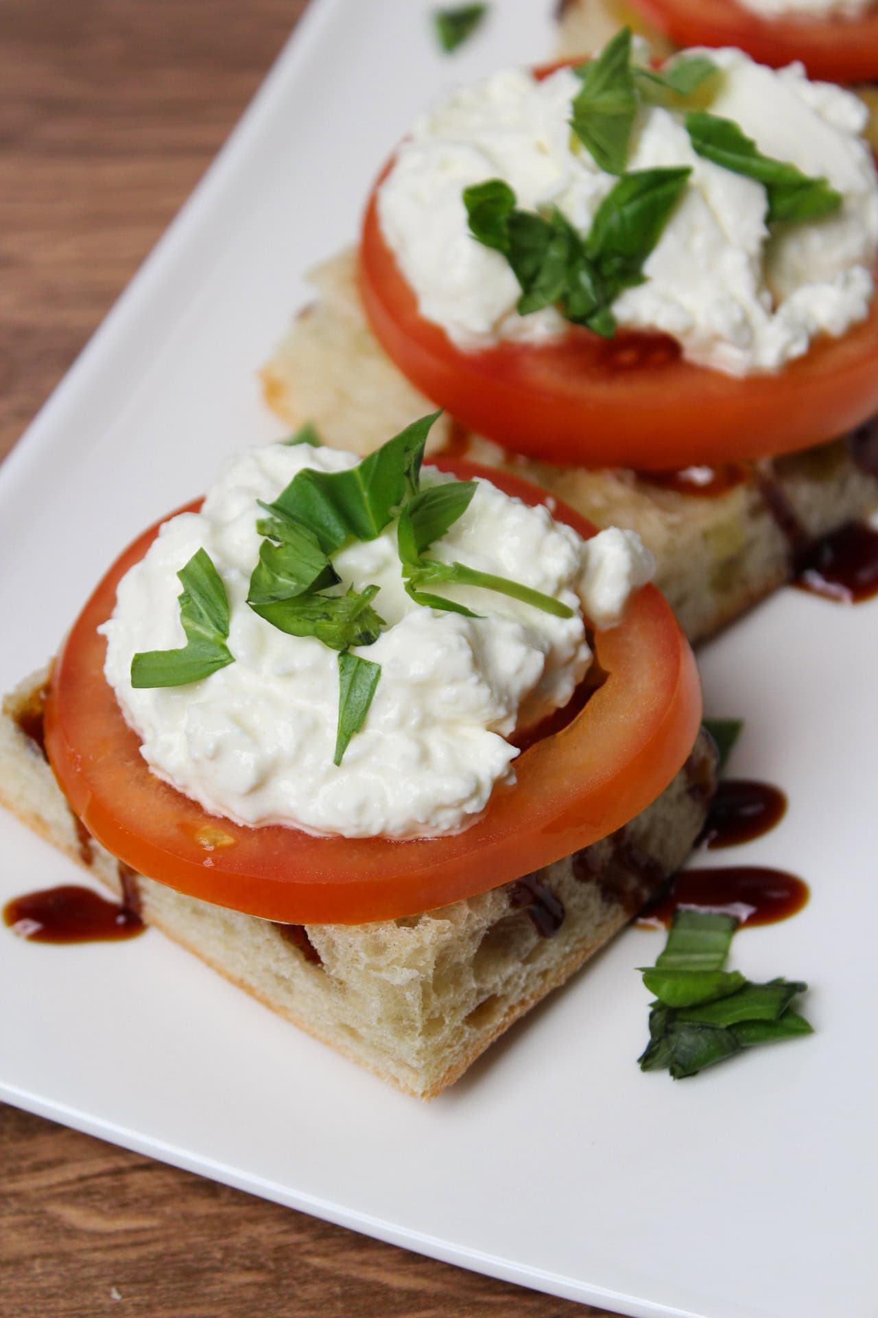 Burrata toast with tomato and basil.