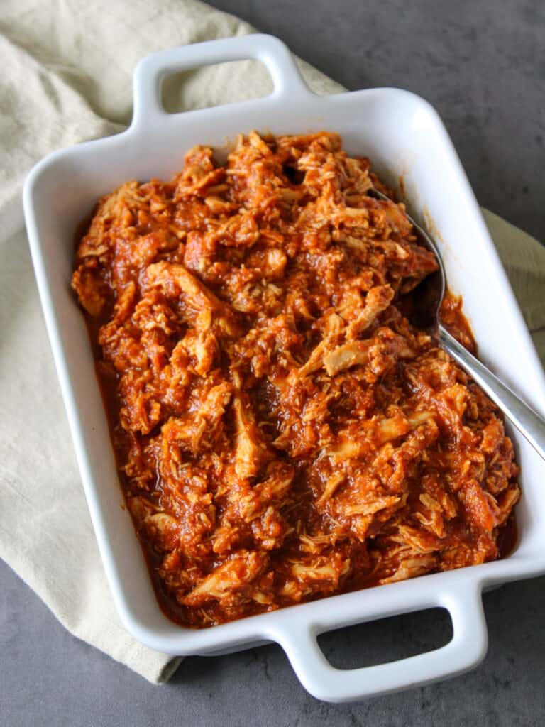Shredded chipotle chicken in a serving dish
