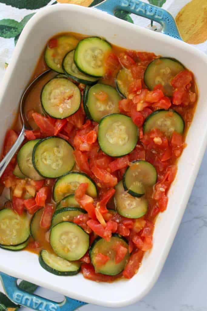 A vegetable side dish of summer zucchini squash and tomato