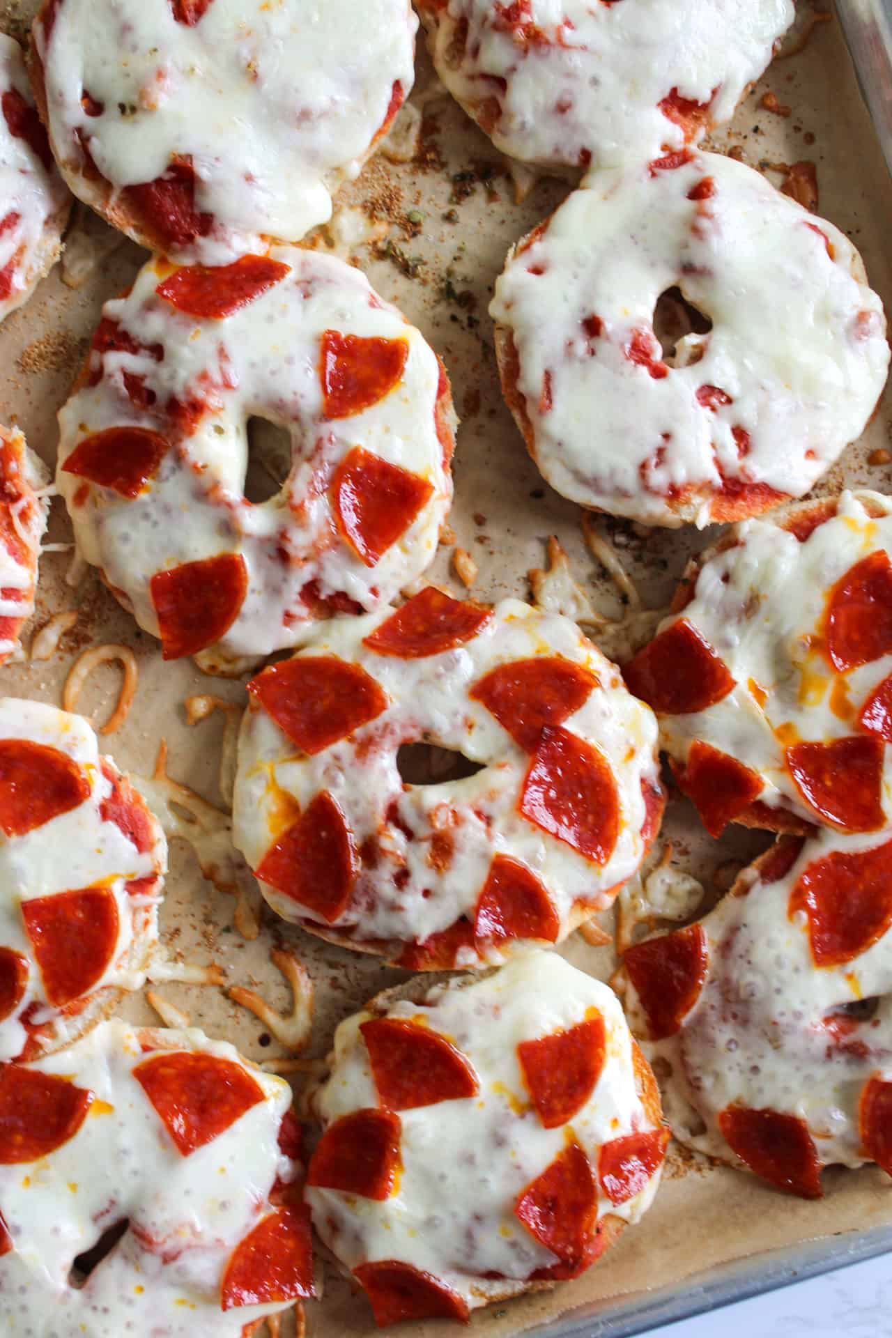 Homemade mini pizza bagels with pepperoni