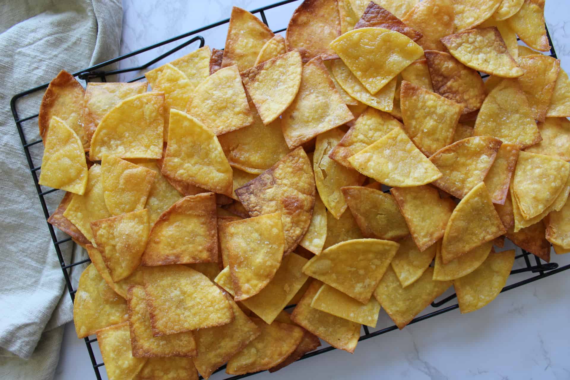 A tray of homemade corn tortilla chips