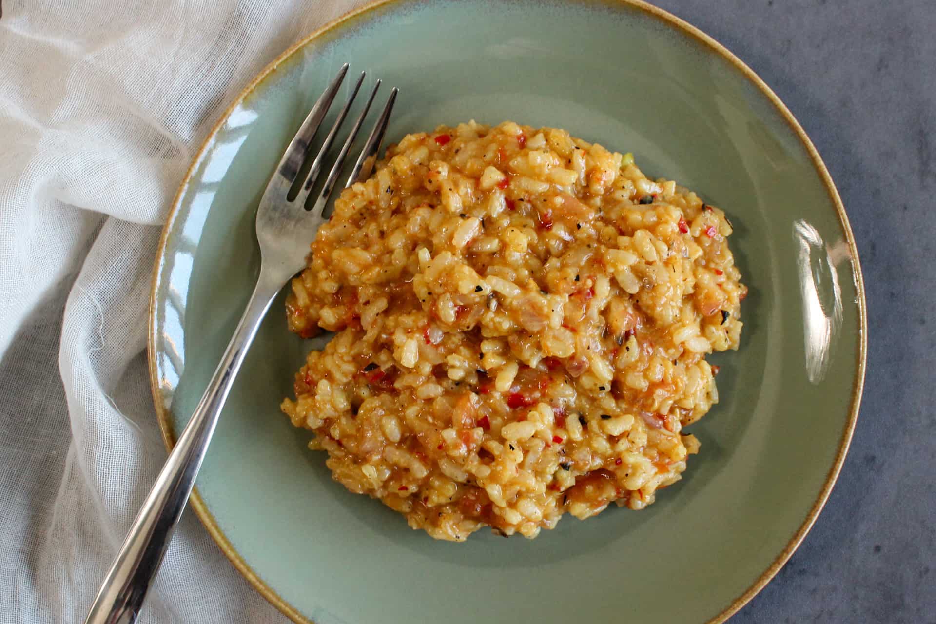 A spicy roasted vegetable risotto on a plate