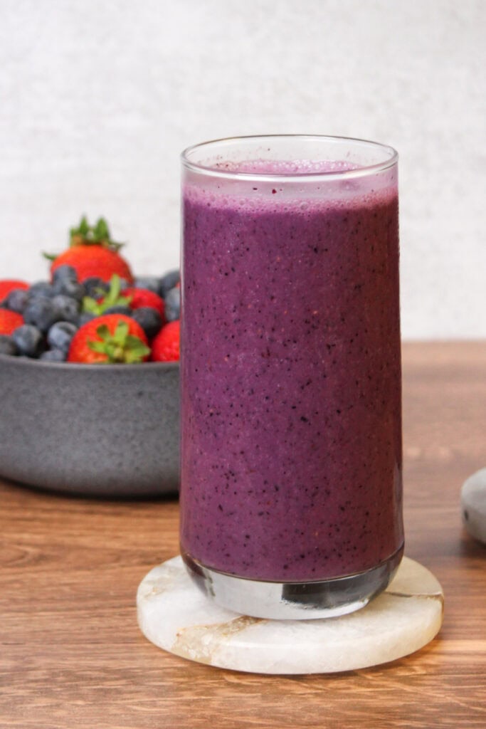 A dairy free smoothie with strawberries and blueberries.