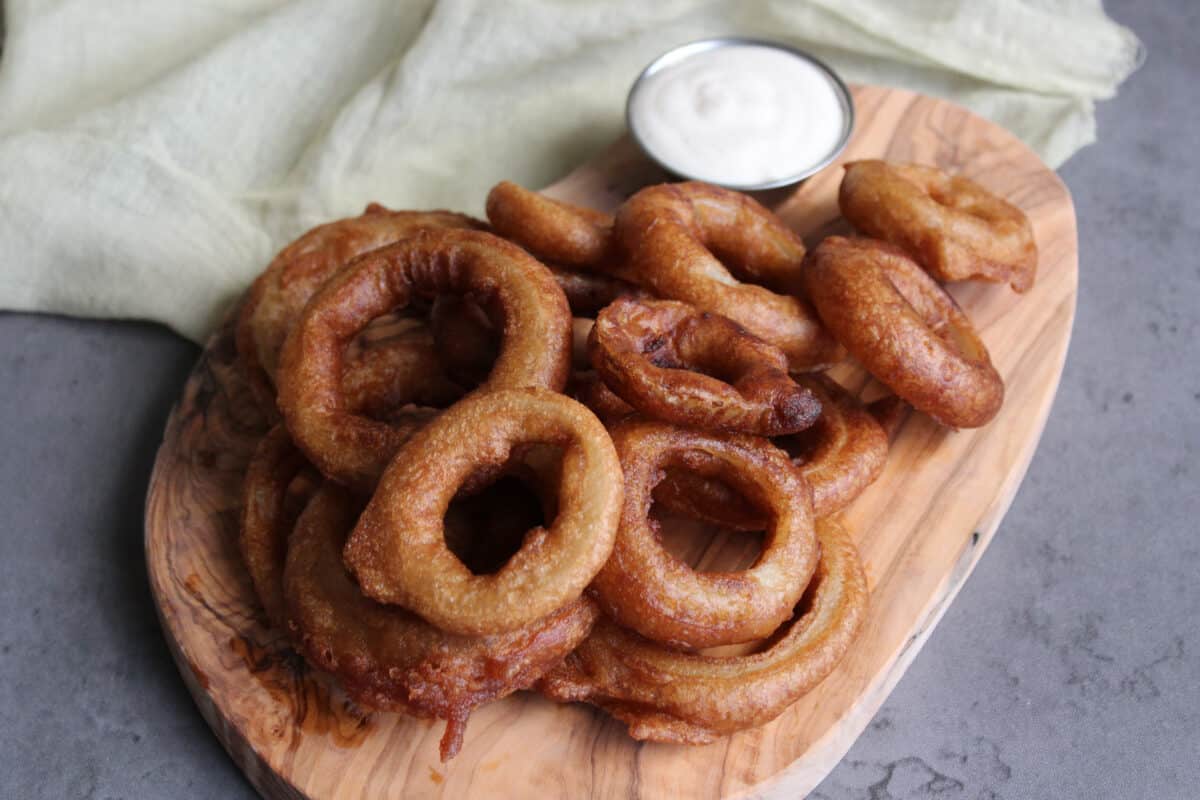 A tray of beer battered onion rings.