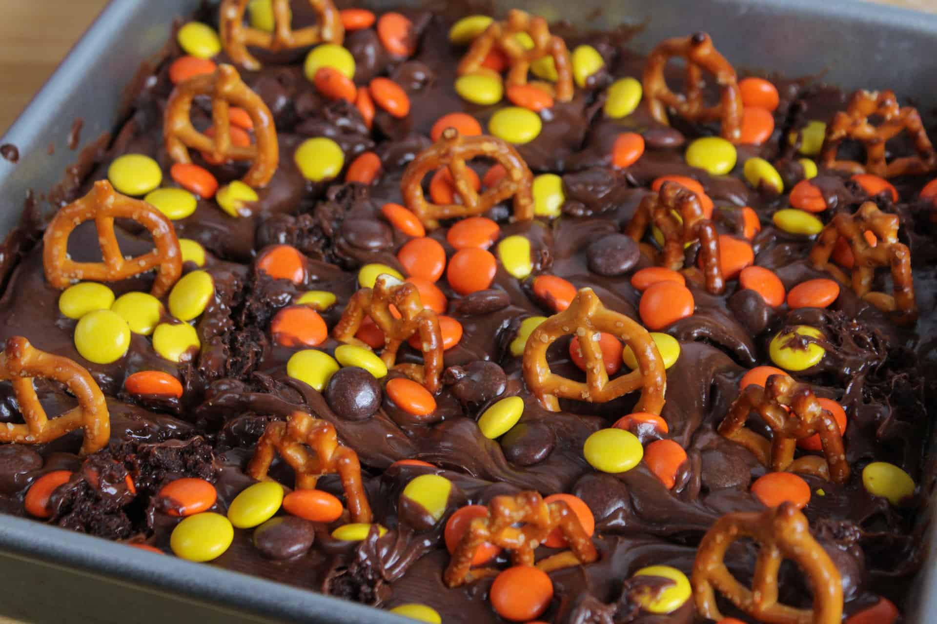 Halloween brownies decorated with pretzels and candy.