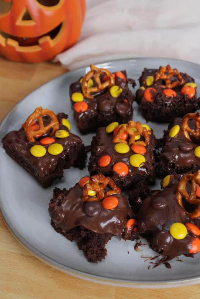 A plate of brownies decorated for Halloween.