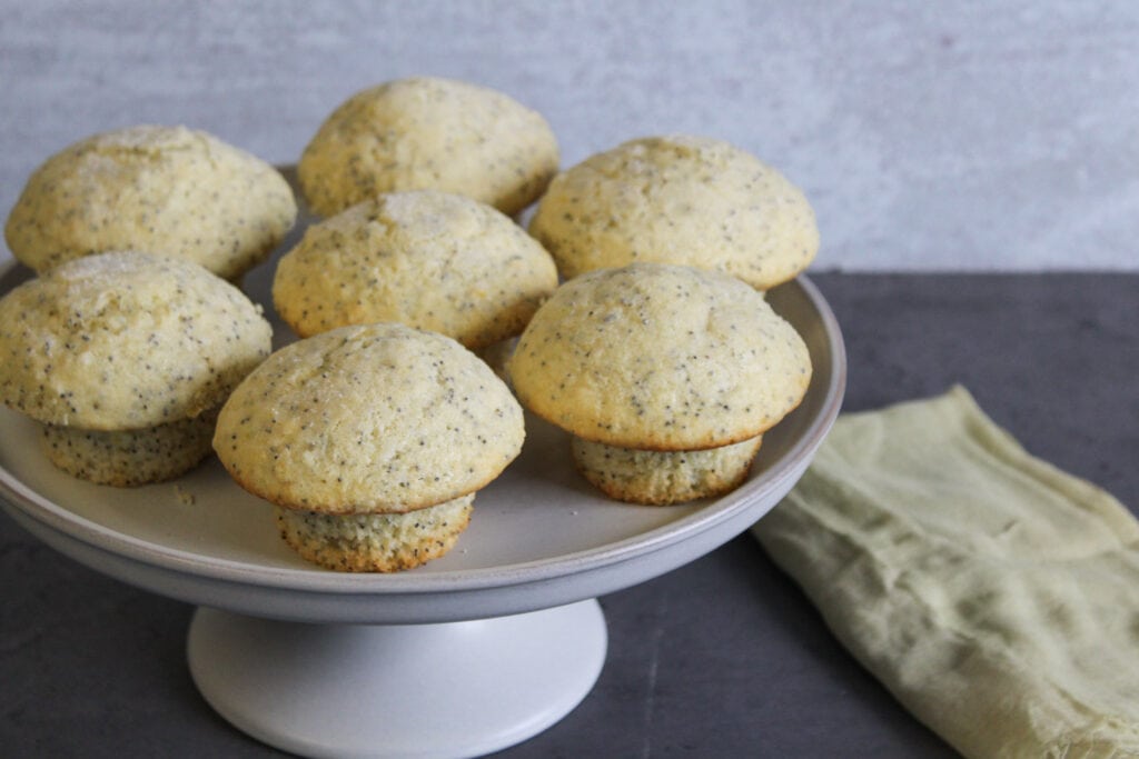 Lemon poppy seed muffins on a tray.