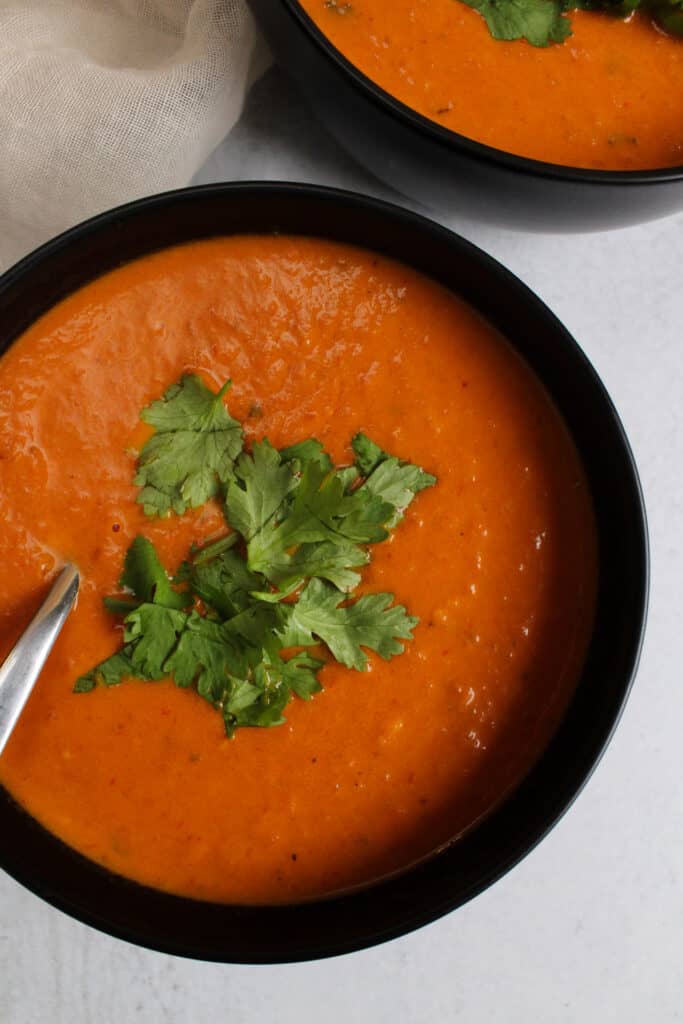 Spicy Indian style tomato soup in a bowl.