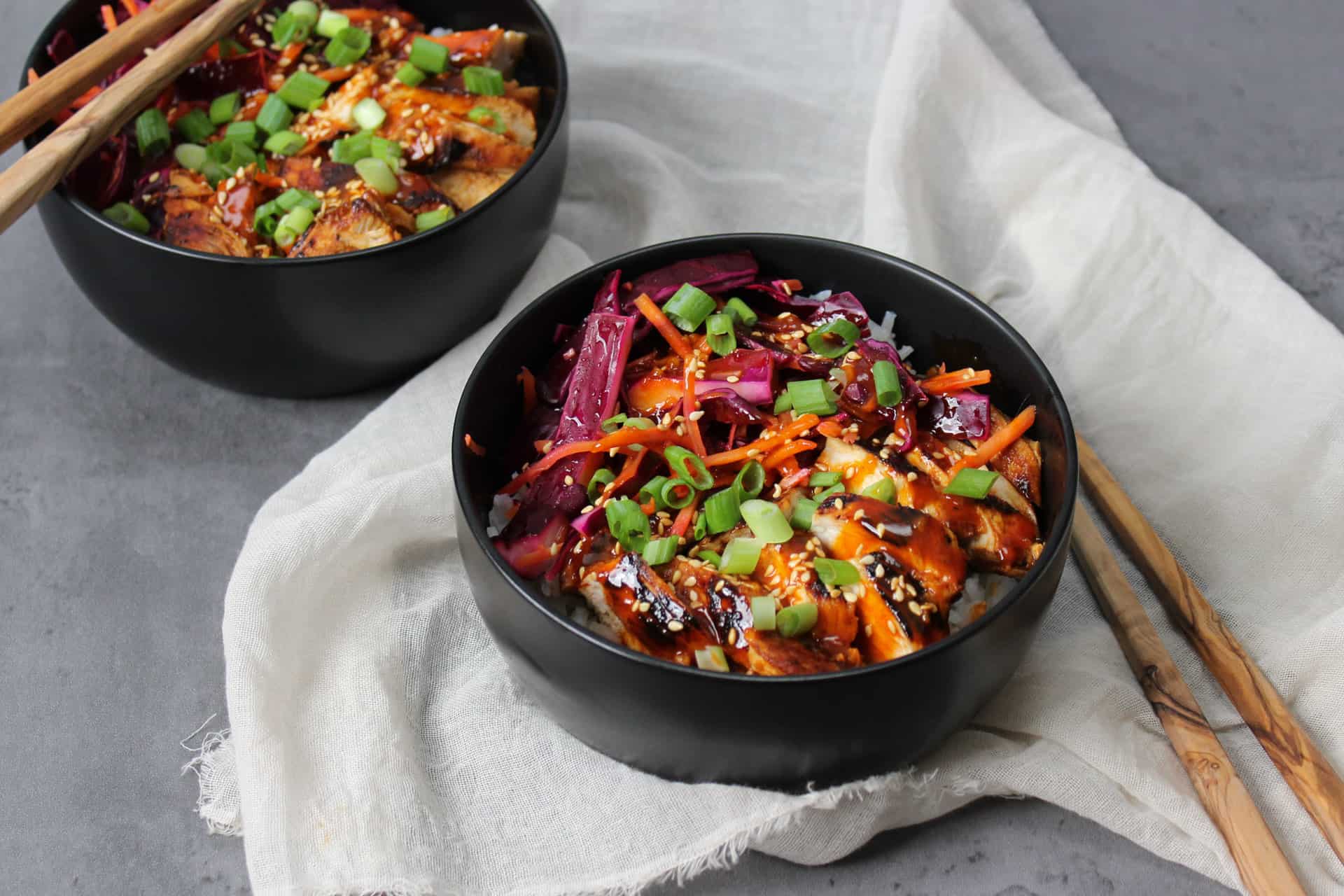 Korean inspired gochujang rice bowls with chicken and pickled cabbage.
