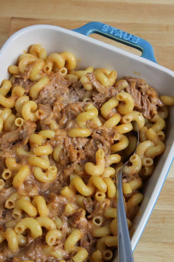 Pulled pork mac and cheese in a baking dish.