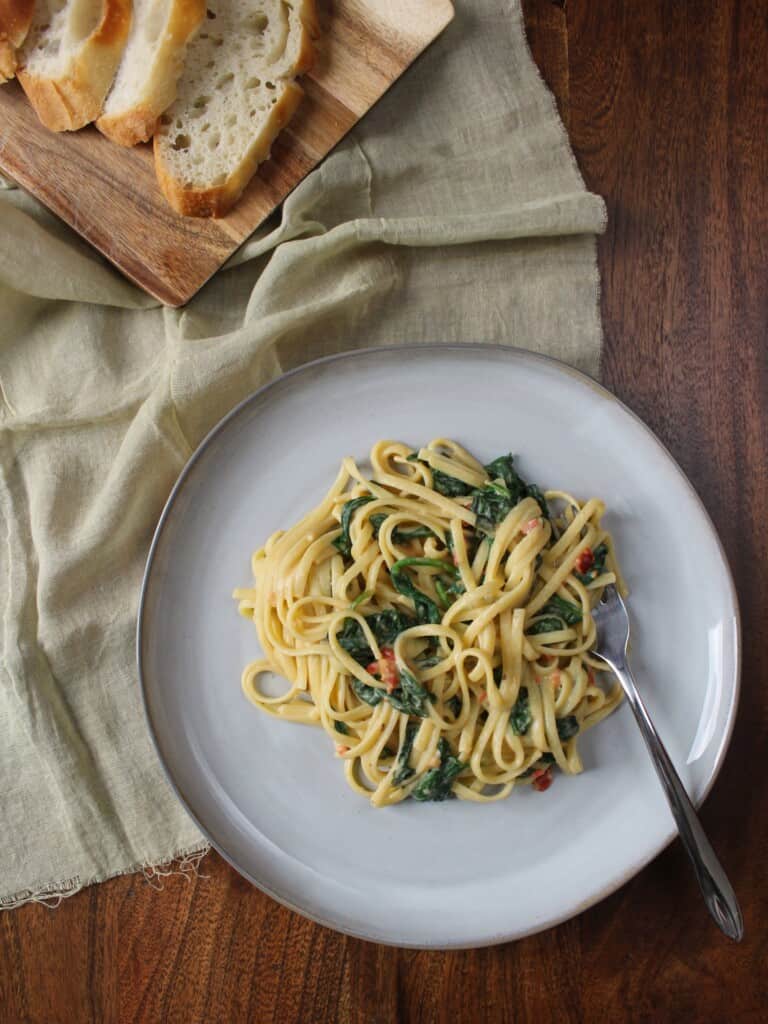 Pasta with spinach and roasted red peppers.
