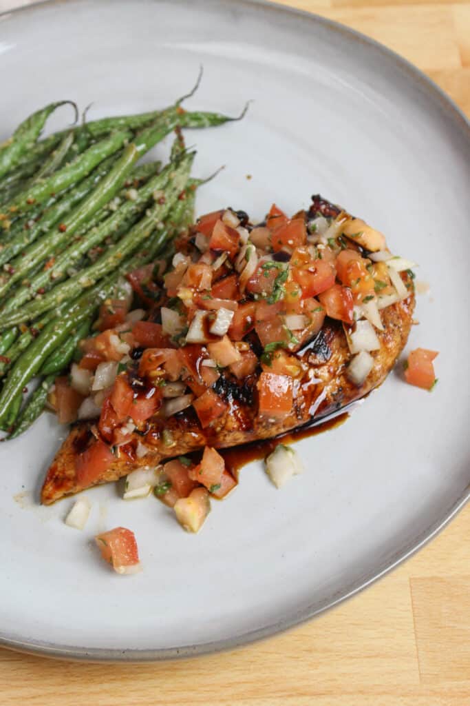 Grilled balsamic chicken topped with bruschetta.