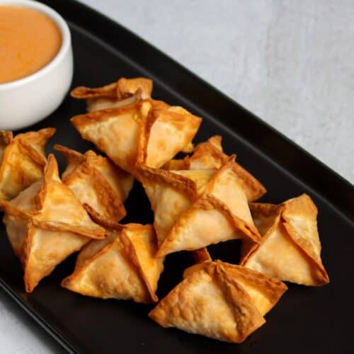 Buffalo chicken rangoons with buffalo ranch dip.