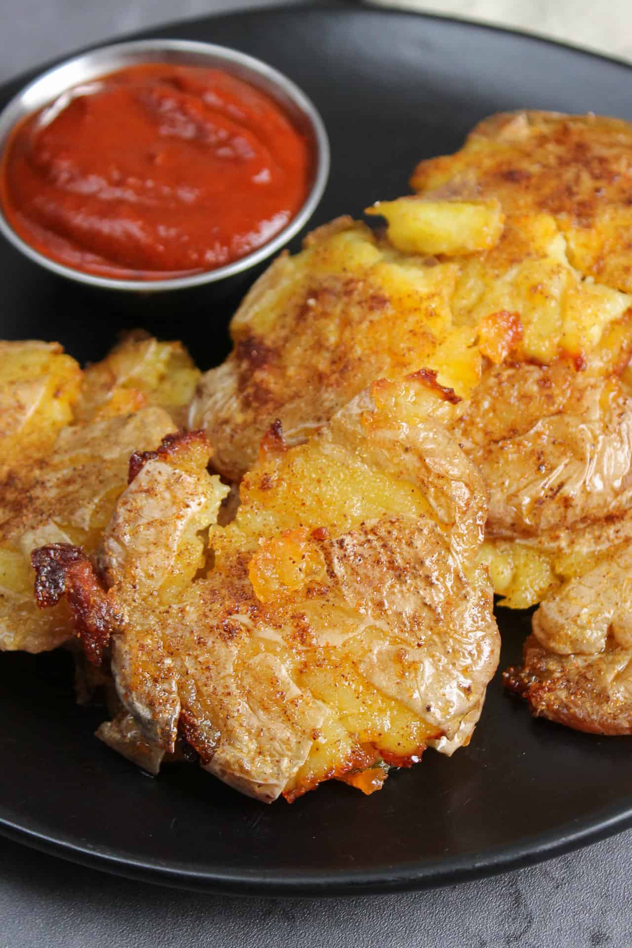 A plate of smashed potatoes.