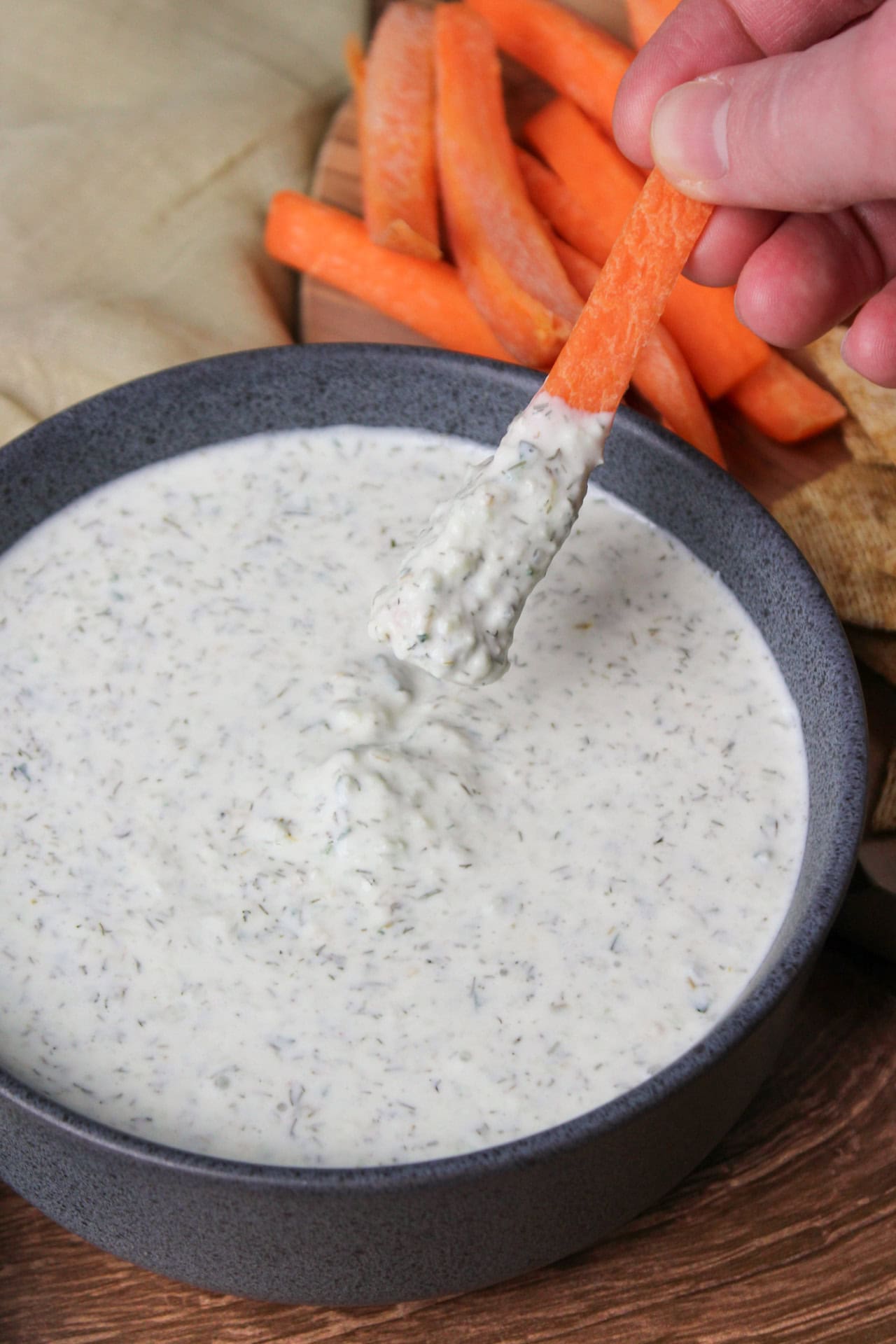 A carrot dipped in tzatziki.