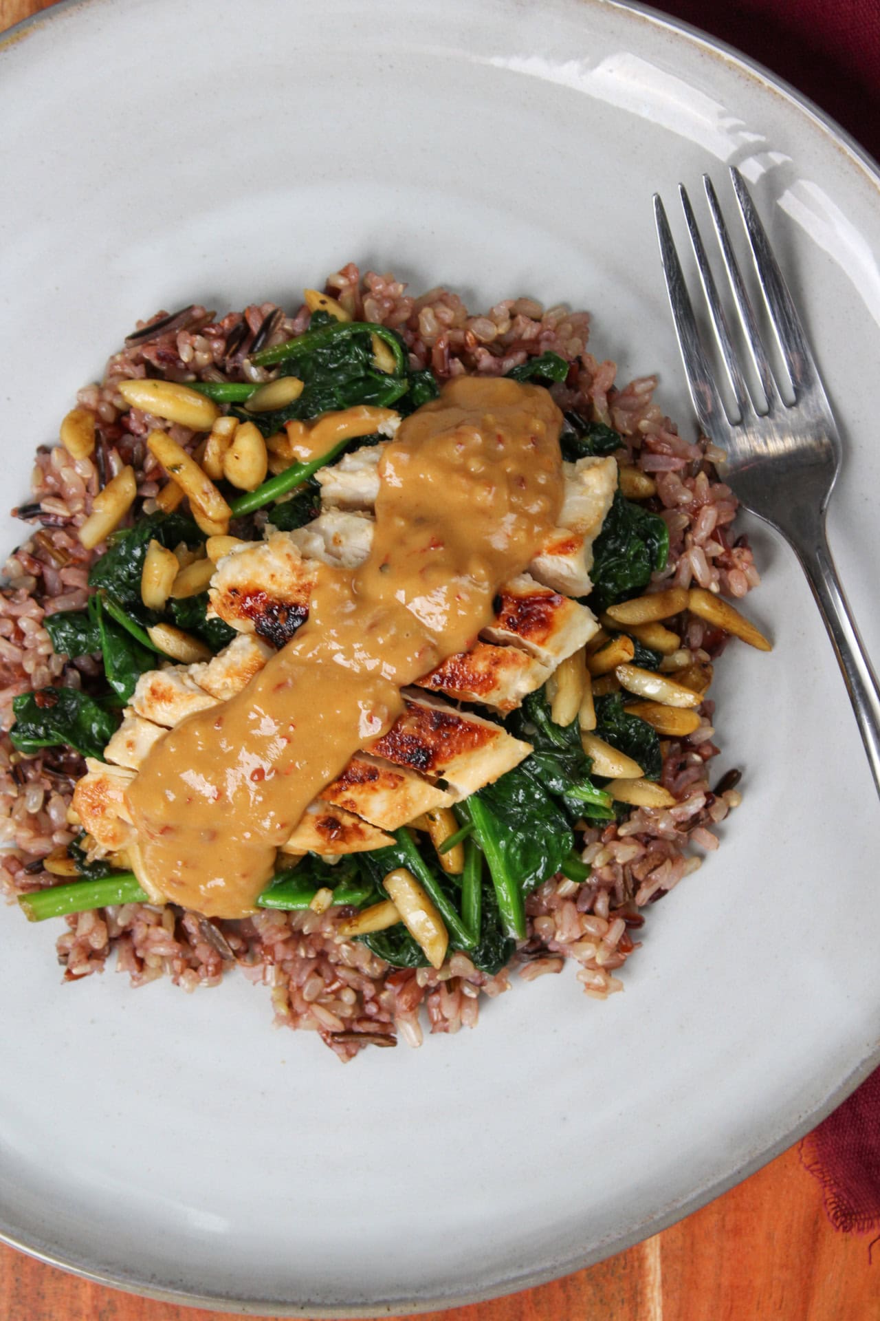 Chicken, cashew dressing, wild rice, and spinach.